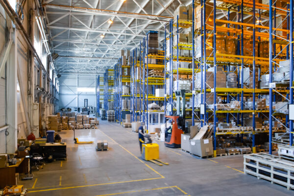 interior modern warehouse storage retail shop with pallet truck near shelves